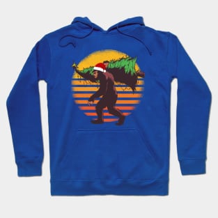 Big Foot Sasquatch Carrying A Christmas Tree Retro Sunset Santa Hat Hoodie